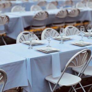 Fitted table covers set up for an event - Super Printers