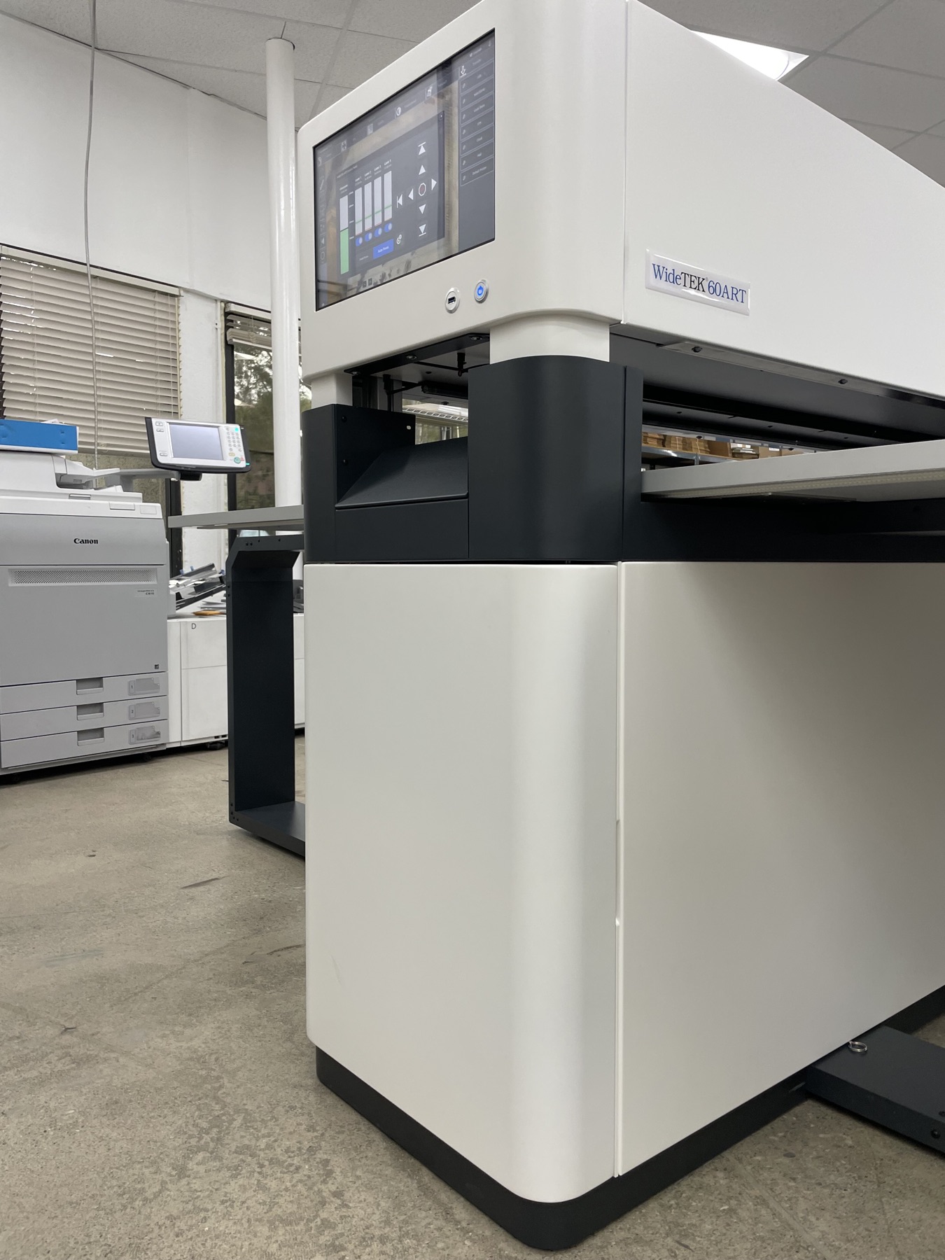 WideTEK 60ART-800 scan bed at Super Printers with labeled archive boxes in the background, Laguna Hills, CA