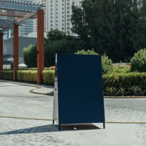 Blank sign board on a stand, representing custom memorial signage - Super Printers